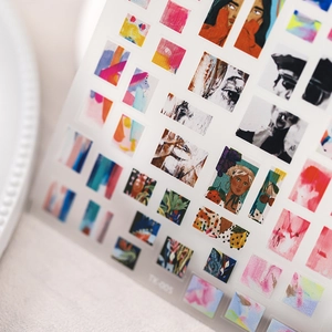 Artistic nail stickers with abstract sketches and botanical motifs on transparent backing