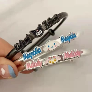 Close-up of enamel metal bracelets featuring Kuromi and My Melody character designs