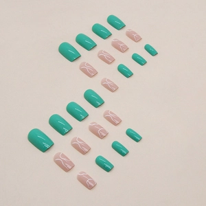 Faux ongles carrés verts et roses avec des motifs vagues blanches et finition brillante