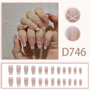 Pink French ballet press-on nails with white tips, pearls, and ribbon bow designs