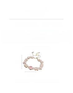 Detail of beaded pearl bracelet with a pink zircon centerpiece and 12.5g copper hardware