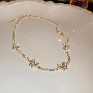 Elegant gold butterfly tennis necklace with sparkling white crystals for women