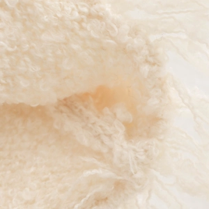 Women's cream knit set with plush texture and decorative fringe detailing