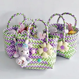 Three colorful handwoven baskets with yellow flowers and cute plush bunny charms