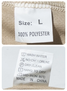 Detail of clothing size label and wash care instructions showing 100% polyester fabric