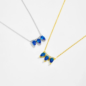 S925 sterling silver teardrop crown necklace with blue gemstones in gold and silver