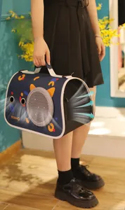 Detail view of large side ventilation mesh on a blue patterned pet carrier bag