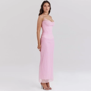 Detail of pink mesh maxi dress featuring lace bodice and elegant side slit hem