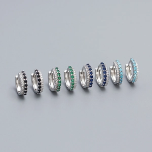 Detail of s925 silver hoop earrings with mixed color rhinestones in four elegant shades