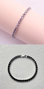 Detailed view of purple and black tennis bracelets with round-cut zircon in silver claw settings