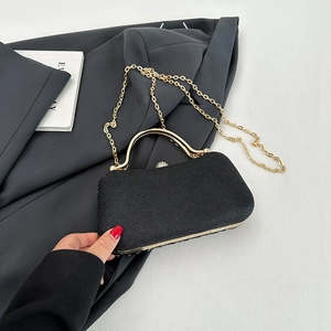 Elegant black glitter evening clutch bag with gold frame and rhinestone clasp details