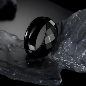 Polished black geometric multifaceted 304 stainless steel ring for men on dark rock
