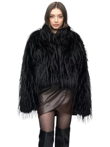 Fashionable thick black faux fur coat for women with a luxurious shaggy texture