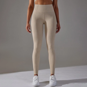 Detail of high-waist yoga pants featuring a seamless honeycomb textured knit fabric