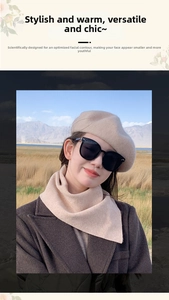 Close-up of beige wool beret and matching knit scarf set worn outdoors in winter