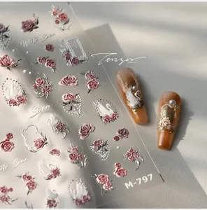 Detailed 5D embossed nail stickers featuring elegant white swans and pink roses