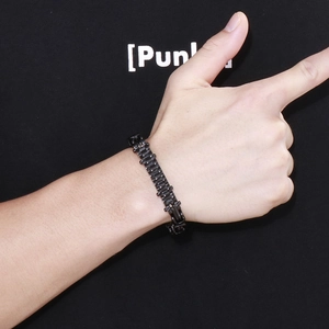 Detailed close-up of a men's black stainless steel watch-style link chain bracelet