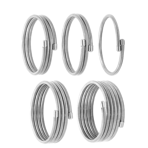 Minimalist silver stainless steel spring coil ring set with multiple layered designs
