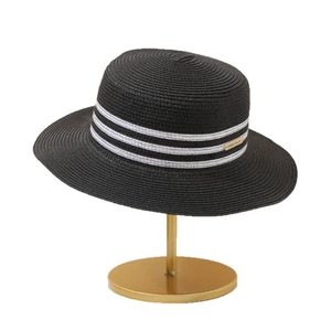 Elegant black woven sun hat with black and white striped band and gold metal detail