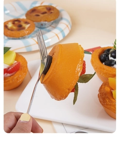 Close-up of realistic faux egg tart fridge magnet showing strong magnetic suction power