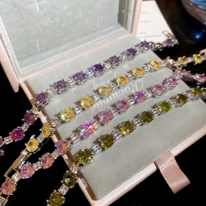 Detail of multi-color tennis bracelets with round and baguette cut cubic zirconia