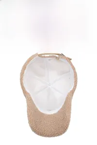 Detail of winter baseball cap interior showing white breathable lining and adjustable strap