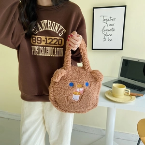 Detail of brown teddy fleece tote bag with cute bear embroidery and 3D ears