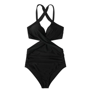Detail of black halter neck swimsuit featuring ruched tummy control and waist cut-outs