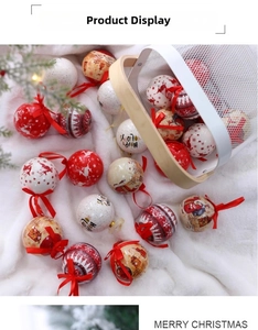 Detail of red and cream Christmas balls with elk patterns and Happy Holidays text