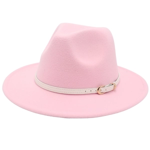 Detailed view of pink wool fedora hat featuring a white leather band and gold buckle detail