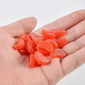 Macro view of 2cm realistic PVC orange slice model showing detailed pulp texture
