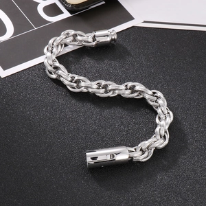 Macro shot of silver woven chain bracelet with industrial cylindrical magnetic clasp