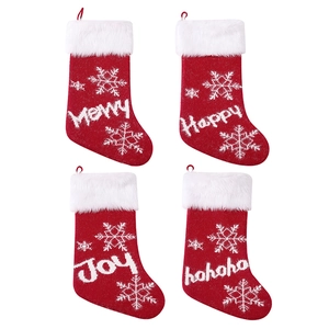 Set of 4 red knitted Christmas stockings with plush white cuffs and snowflake patterns