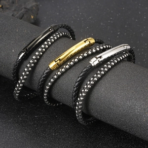 Detail view of double-layer braided leather bracelets with steel magnetic clasps in three colors