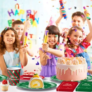 Close-up of Merry Christmas paper plates and cups for festive holiday party table setting