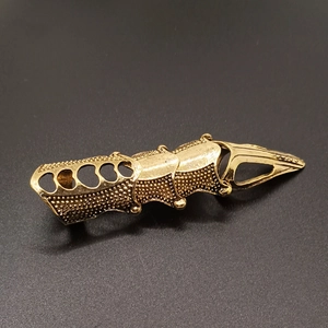 Gothic punk gold joint ring with hollow relief pattern in a cool long articulated design