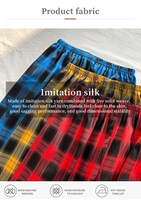 Detail showing smooth imitation silk plaid pajama pants with high drape and satin texture