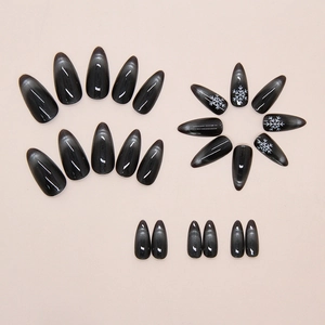 Detail of long almond grey cat eye press on nails with white snowflake patterns