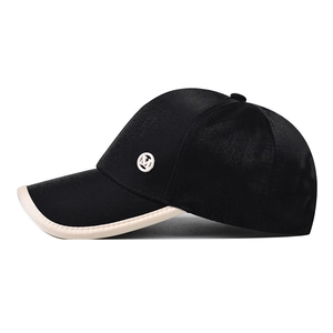 Classic black baseball cap with beige brim trim and minimalist side M letter emblem