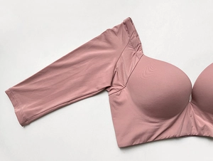 Detailed texture of dusty pink matte high-stretch fabric on push-up sleeve bra