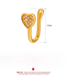 Detail of 1.2cm golden heart-shaped nose clip with micro-inset zircons and copper base