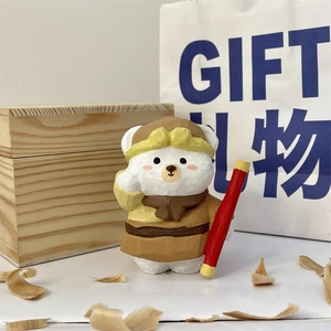 Detailed view of hand-carved wooden Sun Wukong bear figurine with a staff accessory