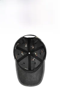 Detail view of cotton baseball cap interior with colorful embroidery and metal buckle