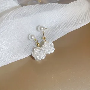Elegant white floral pearl earrings with gold finish for a French vintage style