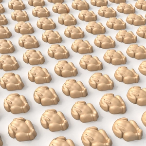 Detail of turkey-shaped silicone baking mold cavities in light brown with matte finish