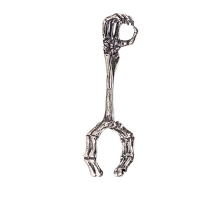 Macro shot of silver skeleton hand smoking ring with retro punk skull bone details