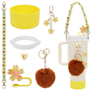 Detail of cup accessories including silicone boot, daisy lanyard, and flower charms