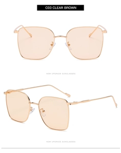 Detail of square gold metal sunglasses with clear brown lenses and slim temples