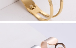 Macro detail of polished titanium steel bracelet with hinge lock mechanism