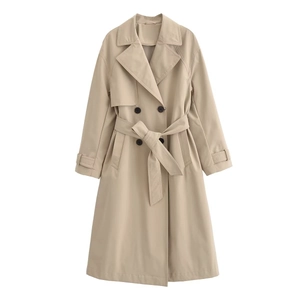 Detail of double-breasted khaki trench coat with matching belt and adjustable cuffs
